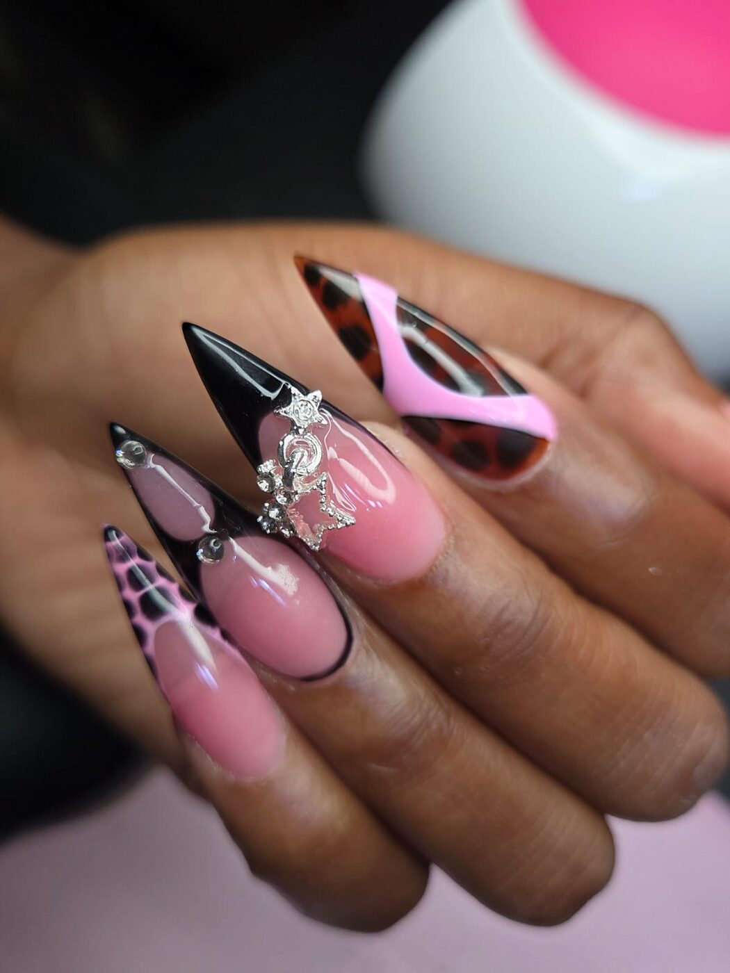 Gel X stiletto nails with leopard and rhinestone art