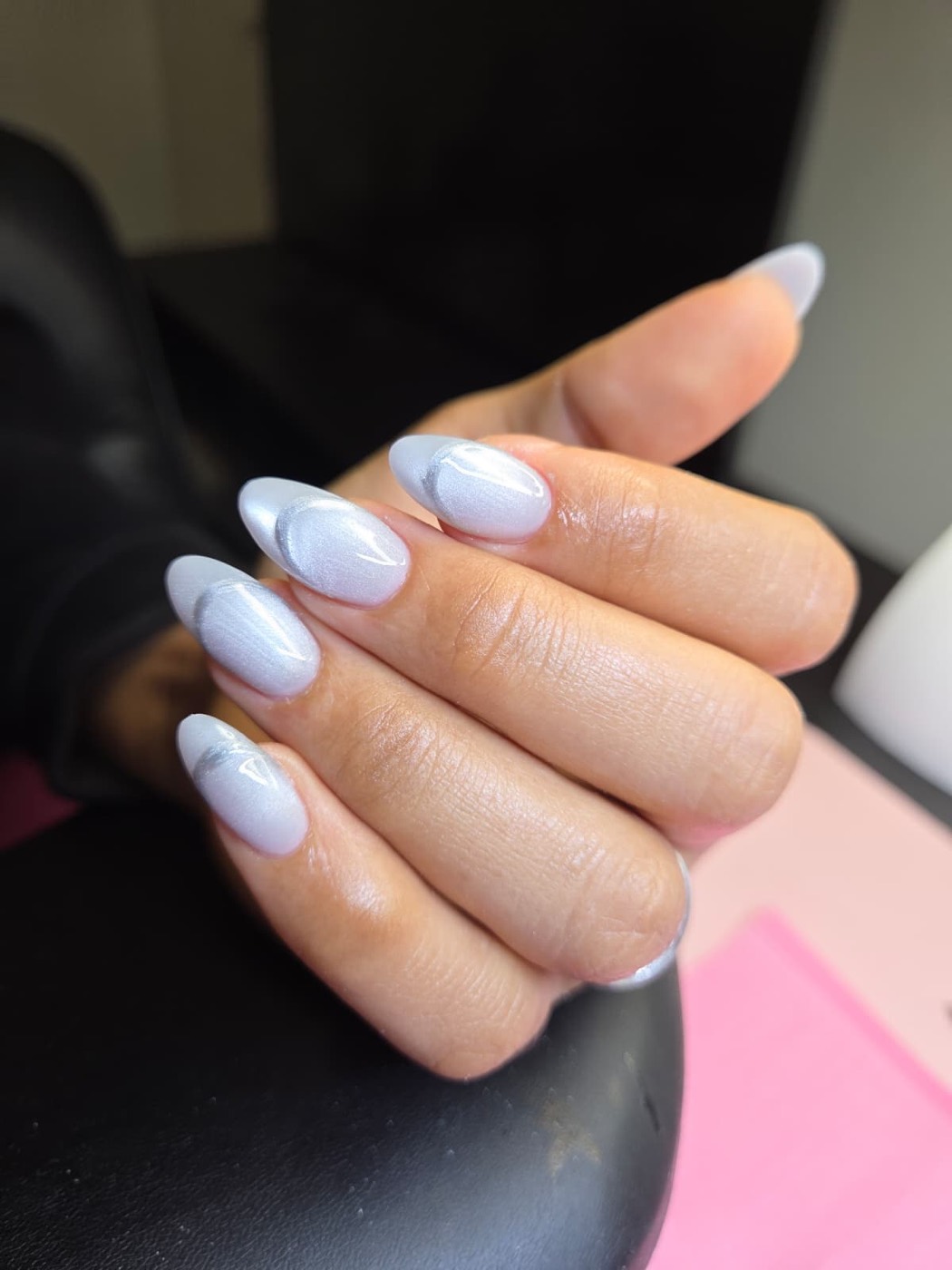 Almond nails in pearly white chrome with a soft velvet finish