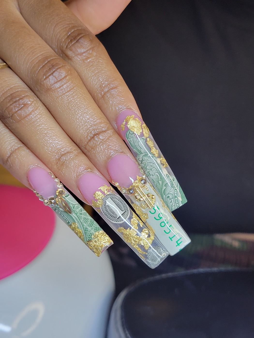 Extra long coffin nails with money art, gold foil, and rhinestone detailing