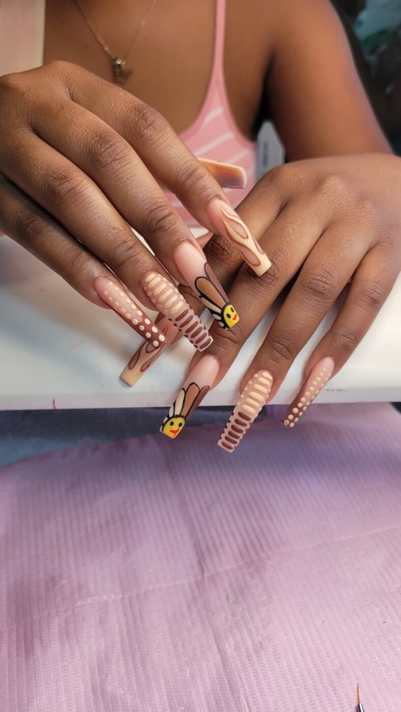 XL acrylic extension with nude tones and bee nail art